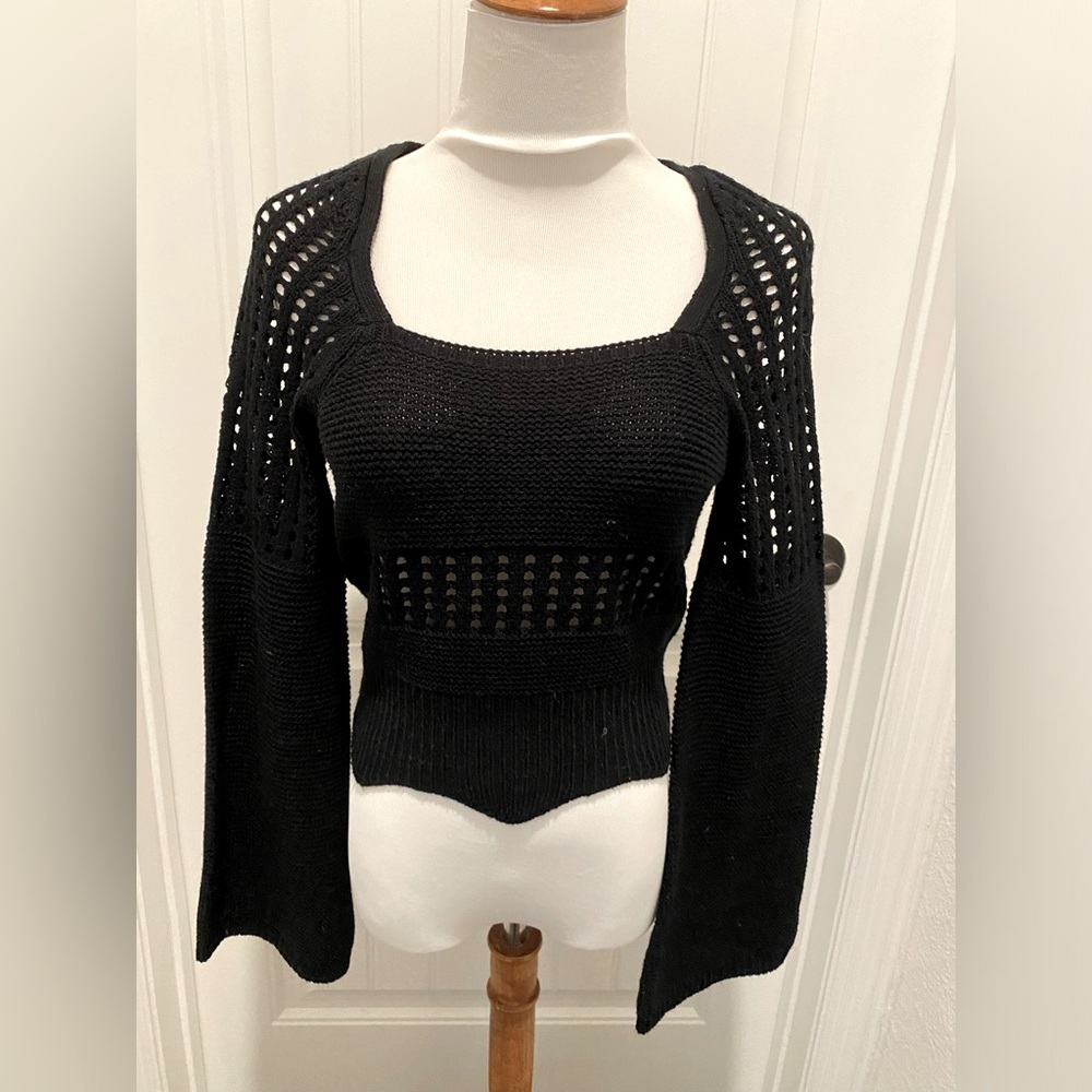 Tight black sweater